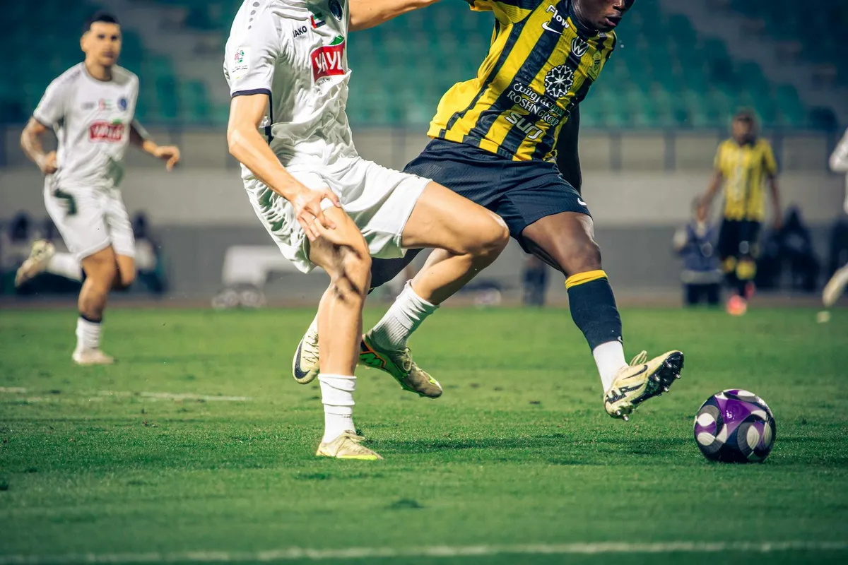 A football star in attacking action